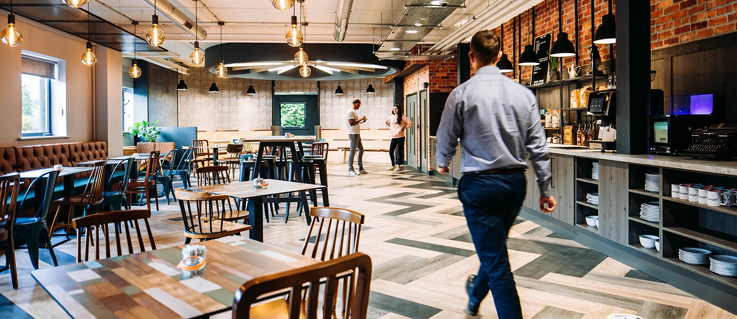 Ideagen cafe with people walking