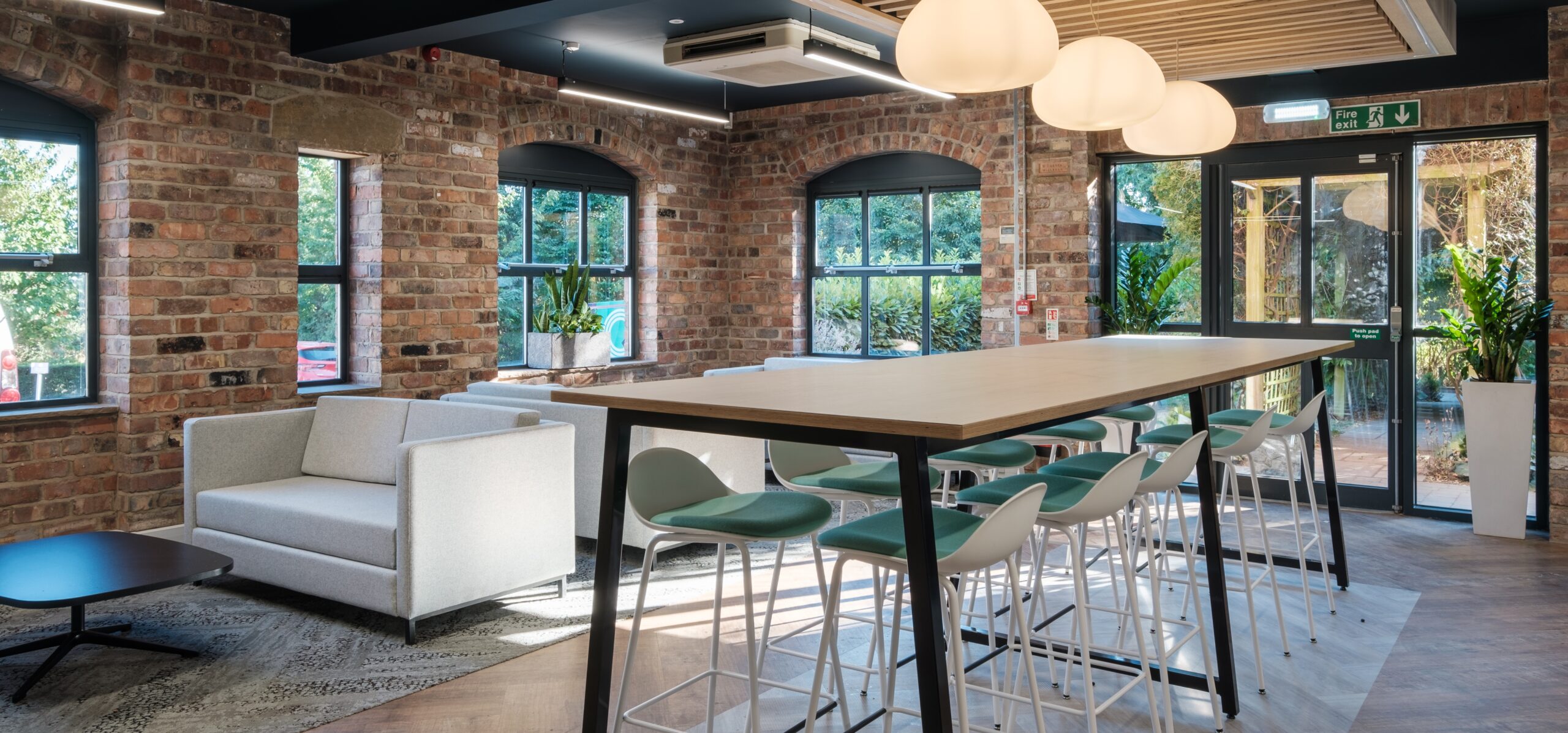 Quickline lunch area with sofa and high table and chairs